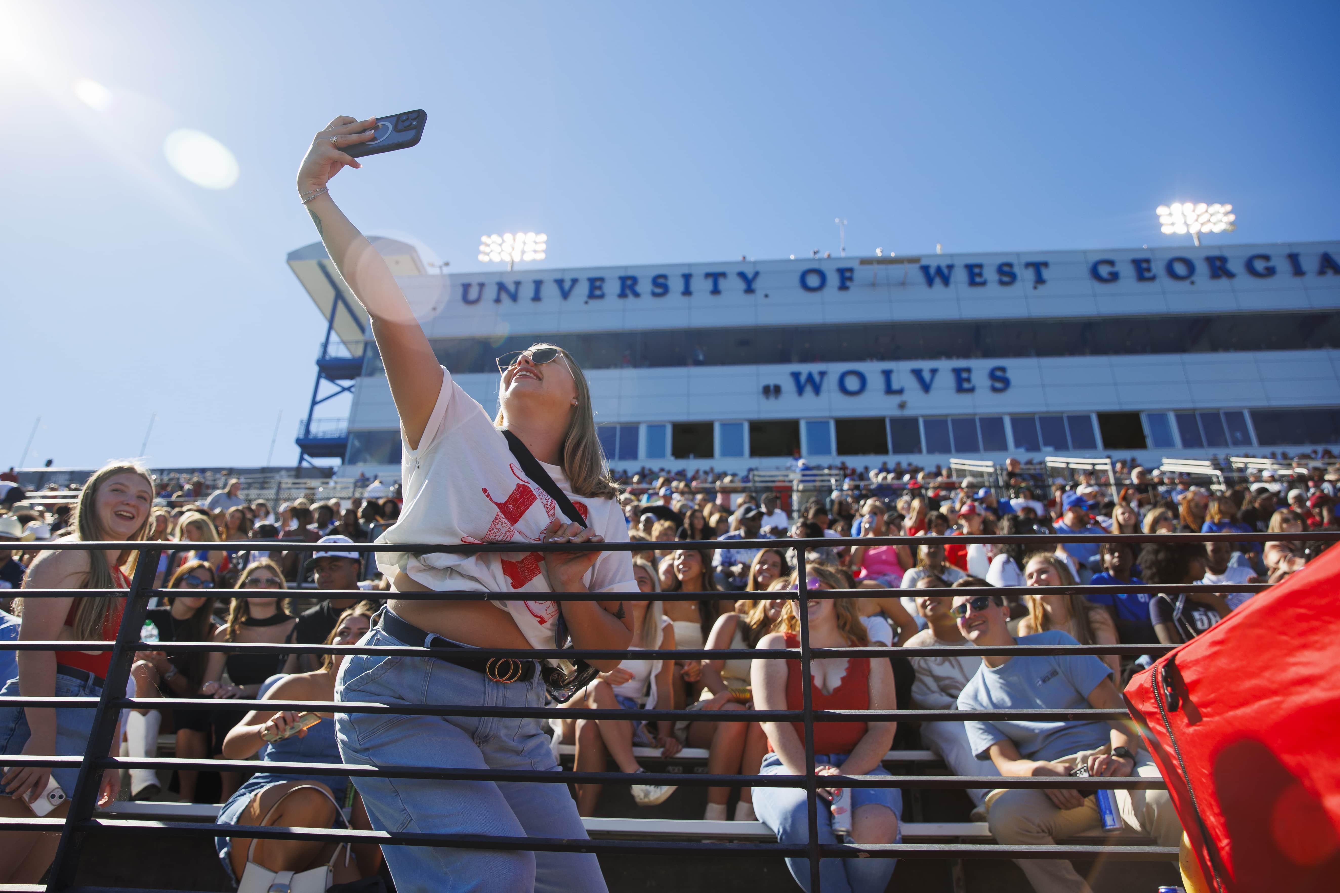 沙巴官网's University Stadium seating packed to the brim with excited students, alumni, fans, and community members!