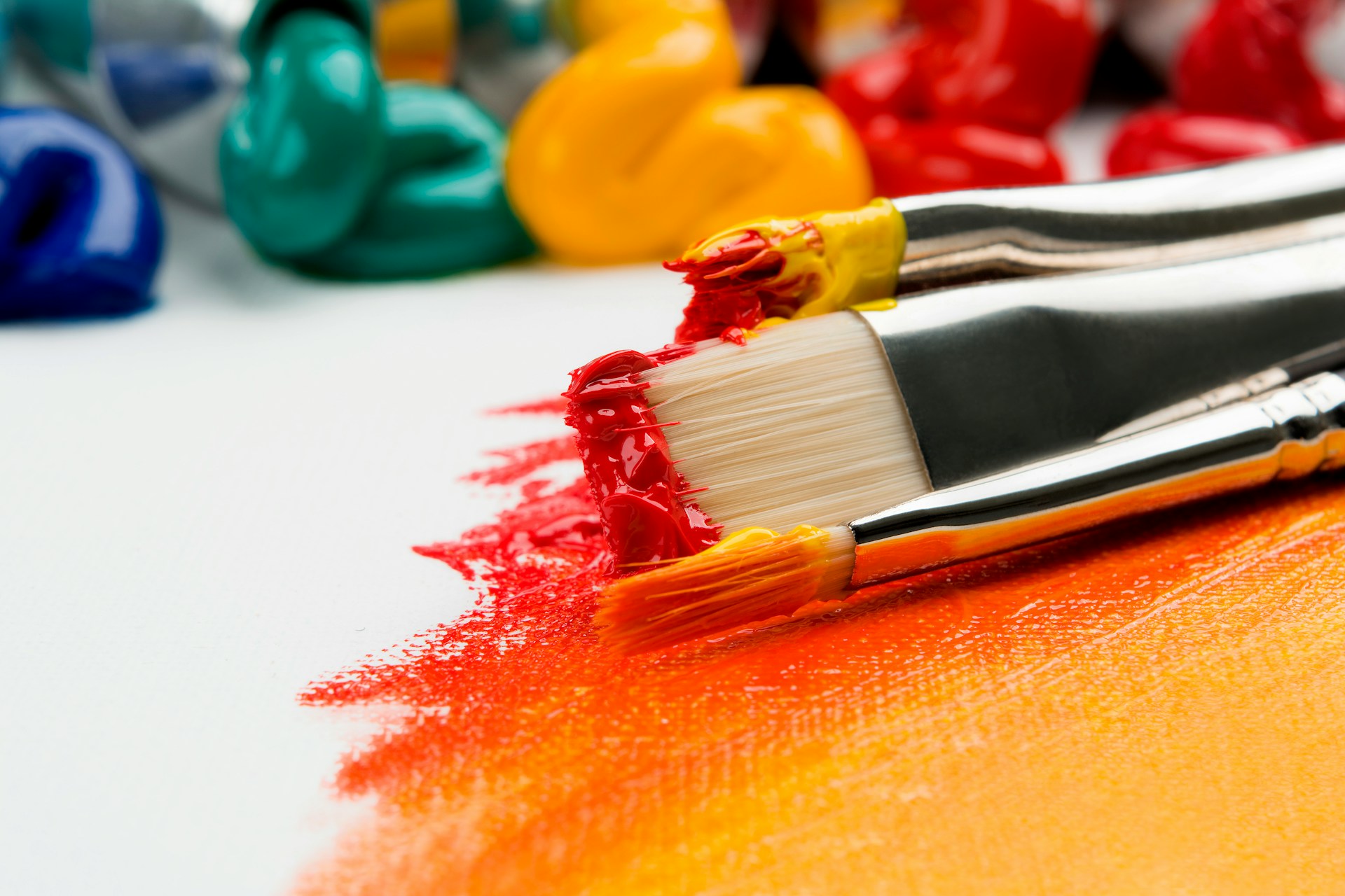paint brushes loaded with paint