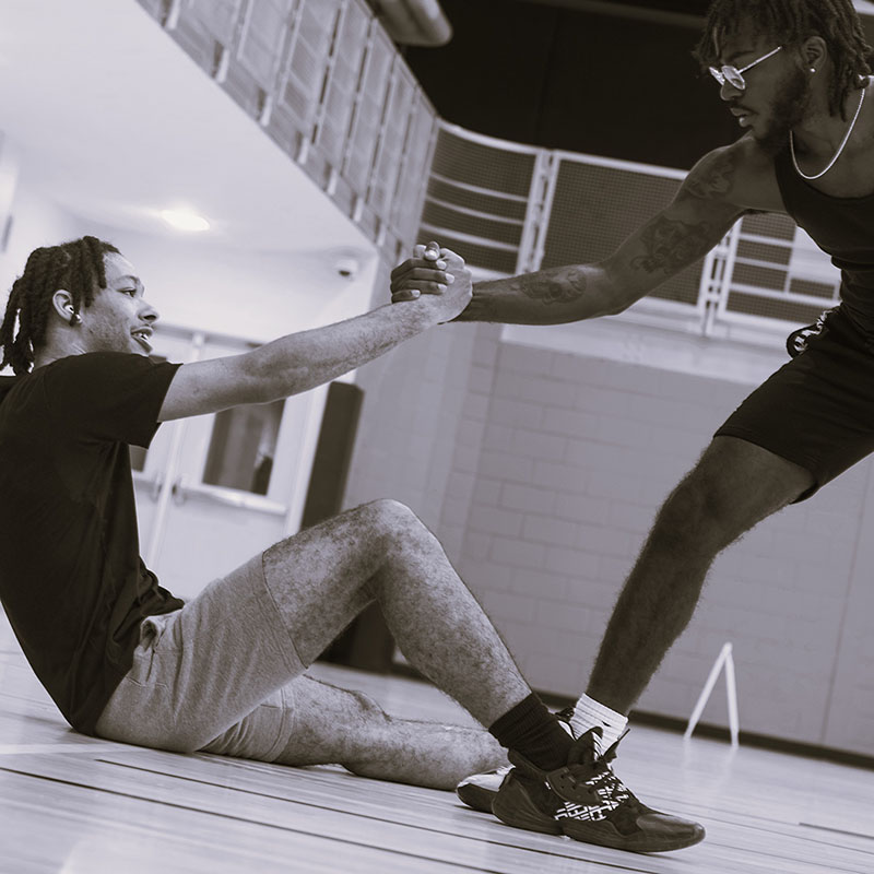photography of male figures playing basketball