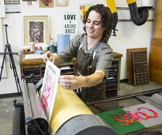 art student printing on press