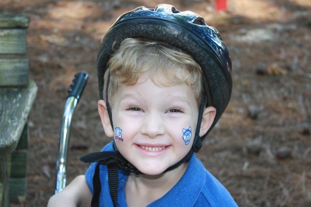 Pre-K student with spirit day stickers.