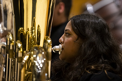 student playing brass instrument