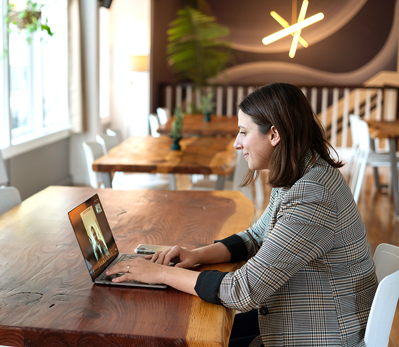 student at table with laptop