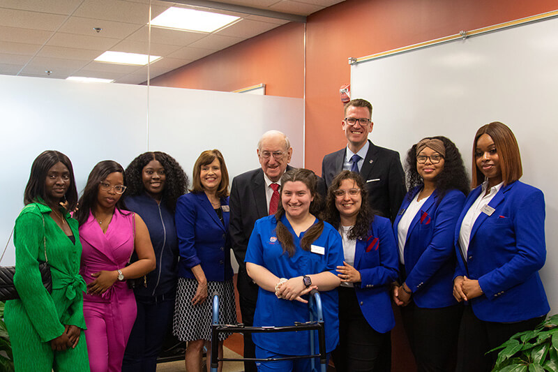 Dean of UWG's Tanner Health School of Nursing Dr. Jenny Schuessler, Herb Hatton, and UWG President Dr. Brendan Kelly recently gathered with nursing students.