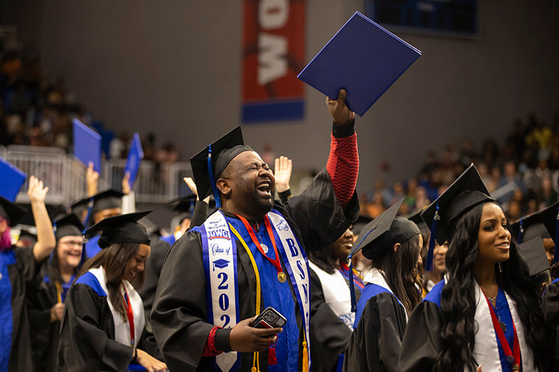 Graduate celebrating at 沙巴官网's Fall 2023 Commencement ceremonies