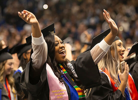 沙巴官网 graduate celebrating at 沙巴官网's Fall 2023 Commencement ceremonies