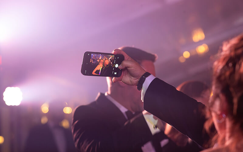 A couple takes a selfie at the 沙巴官网 Presidential Black Tie Gala's afterparty
