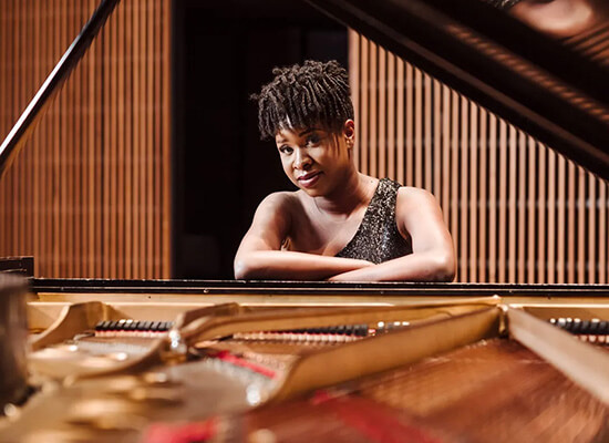 Artina McCain at a piano
