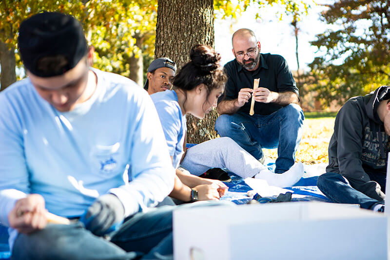 Dr. Nathan Lawres and UWG students
