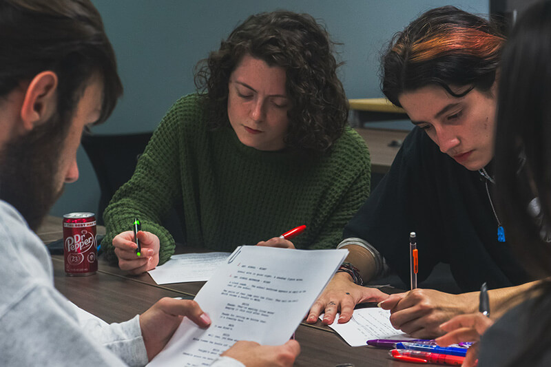 沙巴官网 film students working on a script