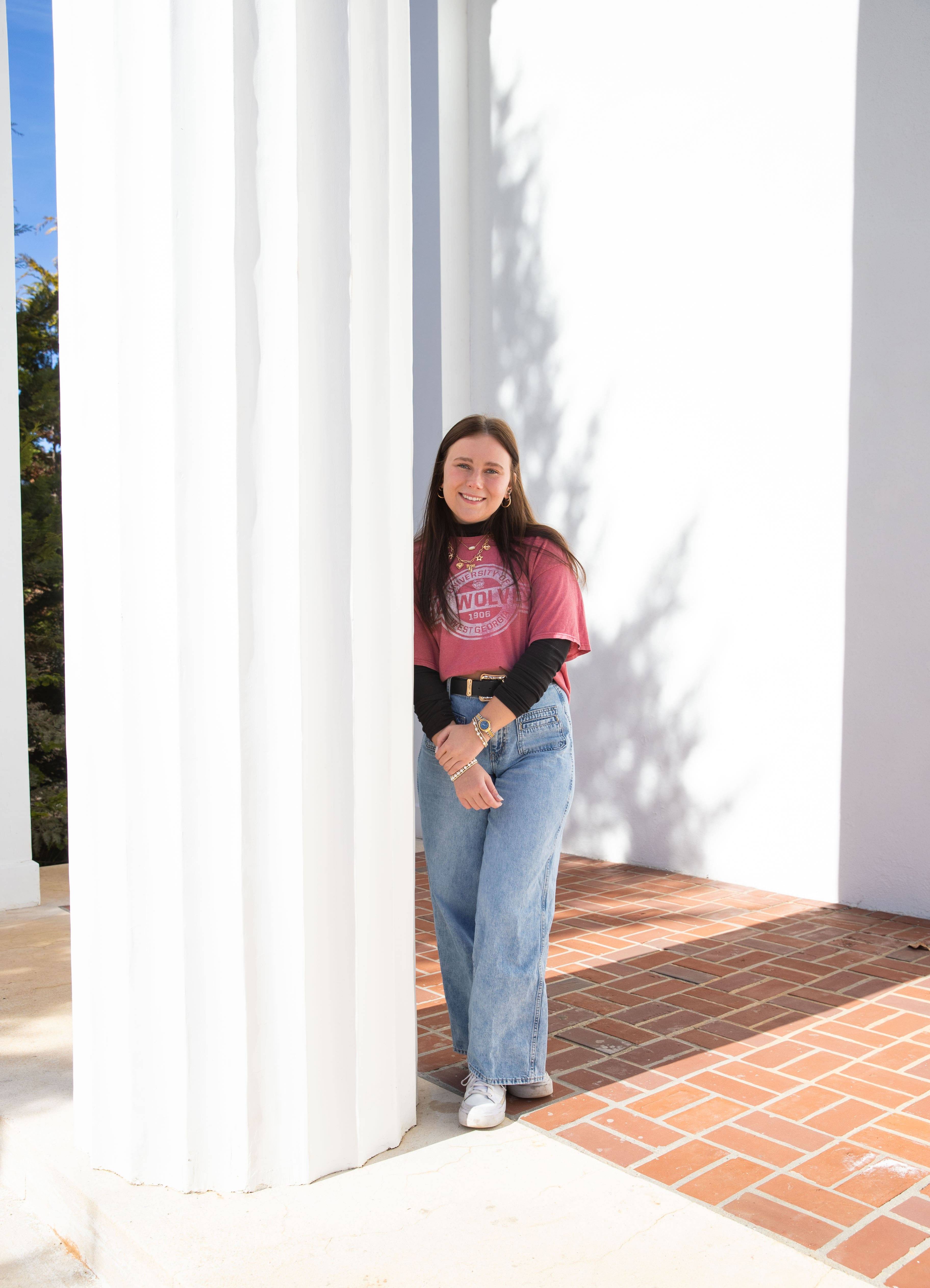 Grace Katherine James posing for an outside portait in her favorite 沙巴官网 outfit!