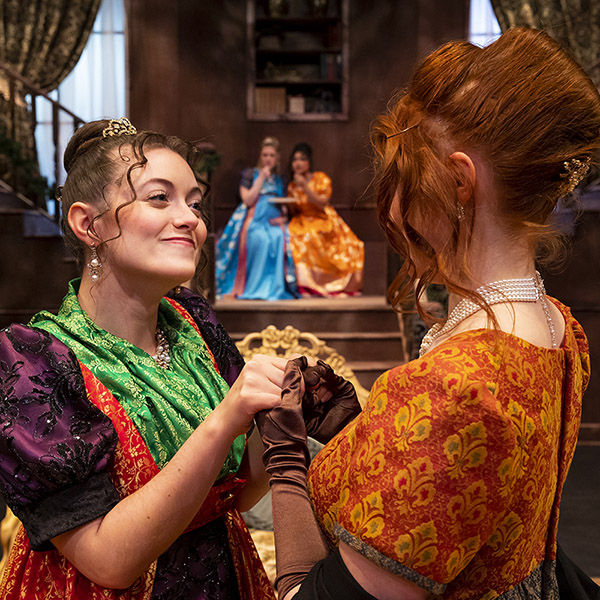two female characters holding hands in Victorian setting